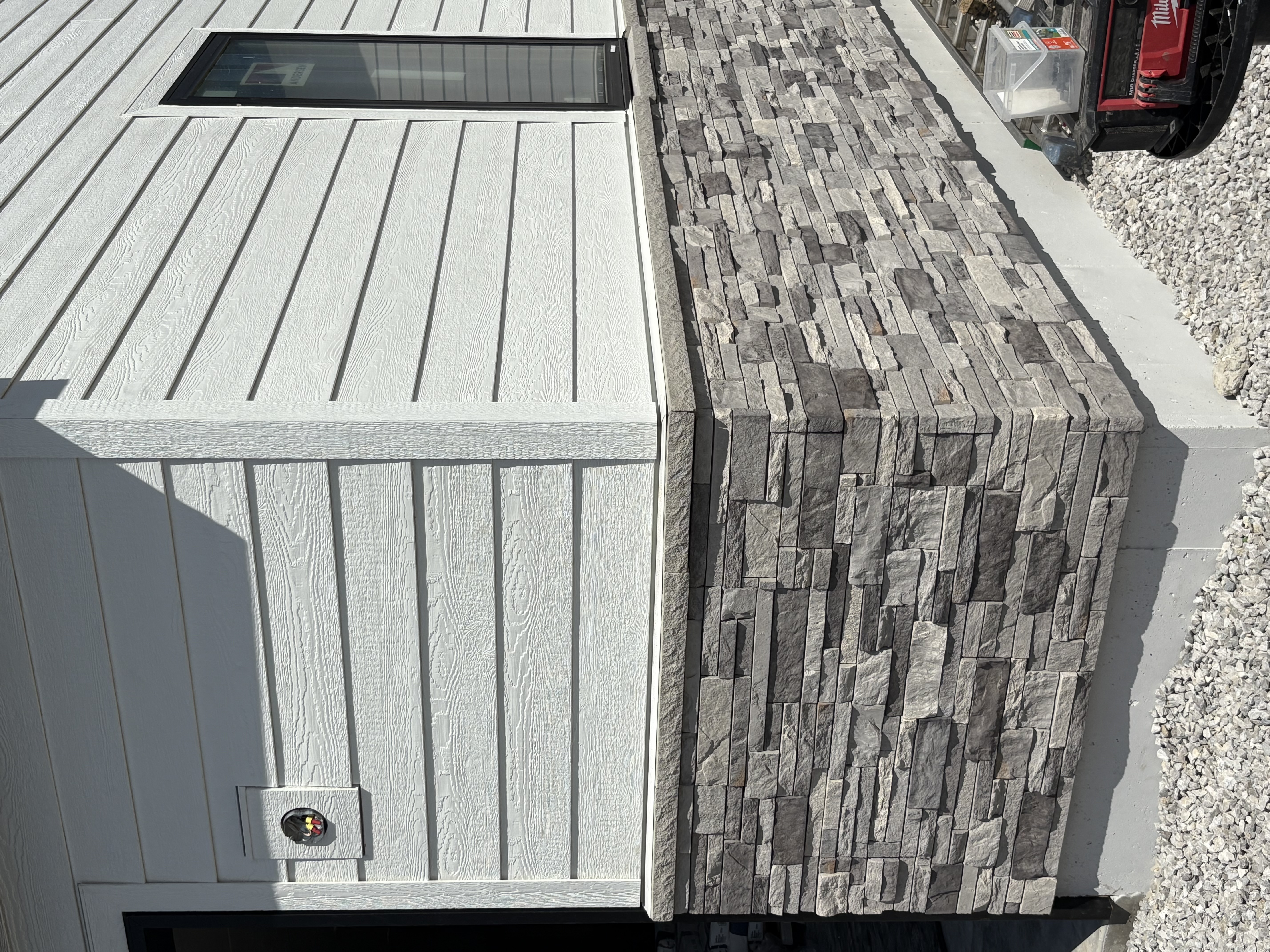 Stacked Ledgestone To Board Batten Detail